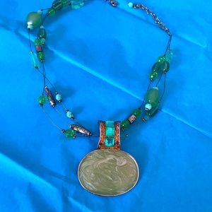 Beautiful green and gold-colored beaded necklace.
